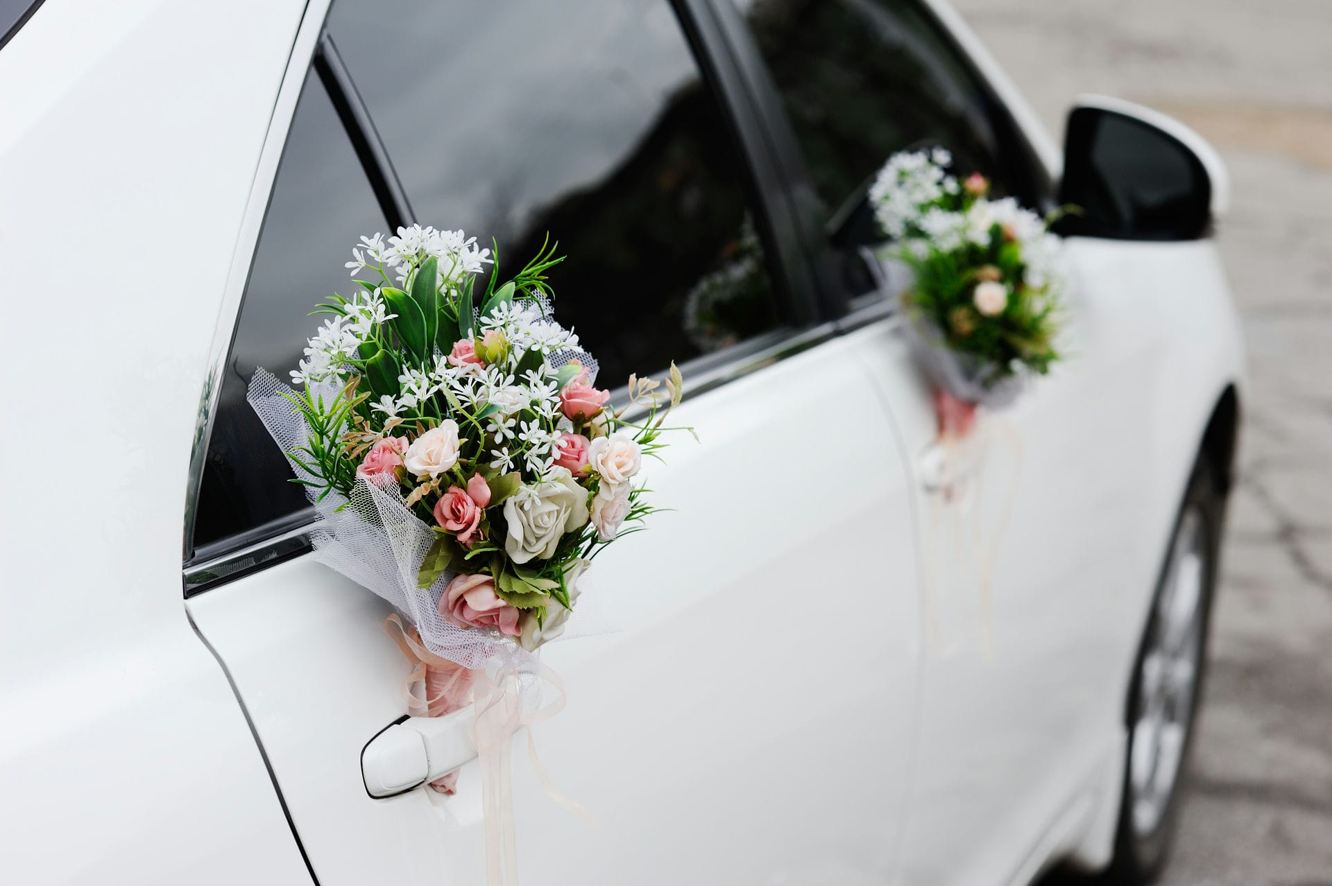 Beautiful decorations for a wedding car. Wedding organization